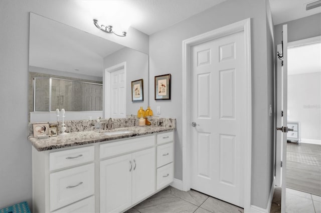 bathroom featuring vanity and walk in shower