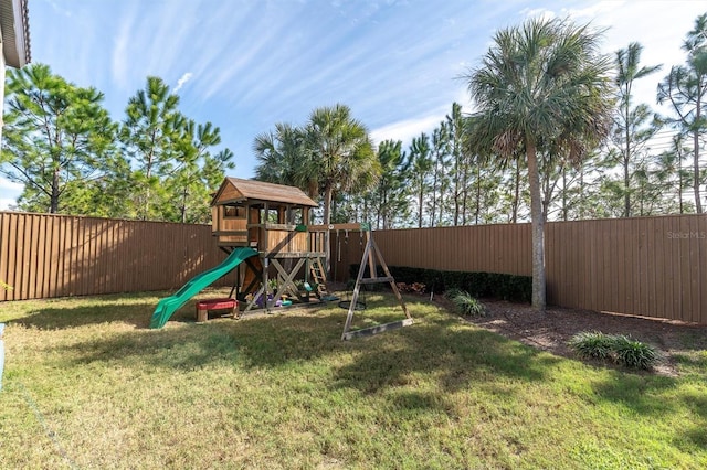 view of jungle gym with a lawn