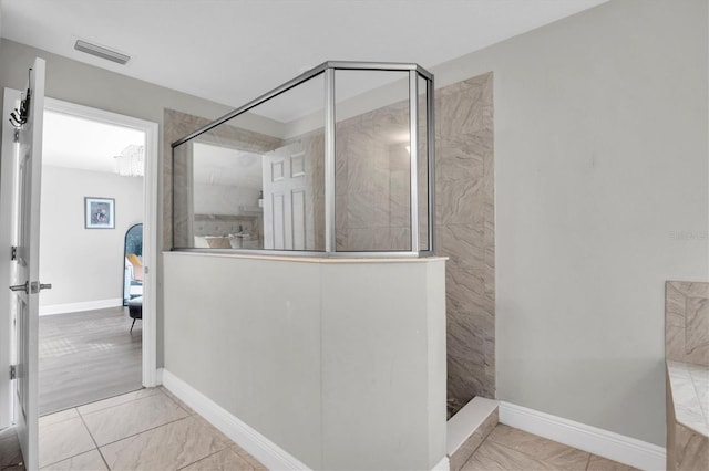 bathroom with a tile shower