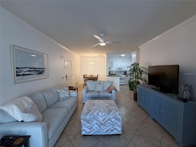 living room with light tile patterned floors, ceiling fan, and crown molding