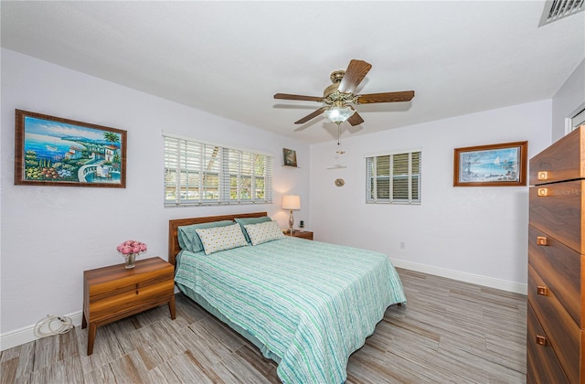 bedroom featuring hardwood / wood-style floors and ceiling fan