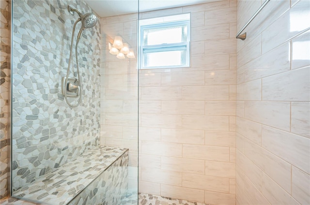 bathroom featuring a tile shower