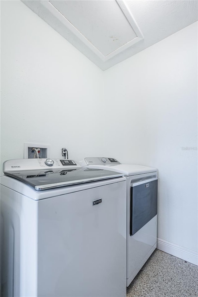 washroom featuring washer and clothes dryer