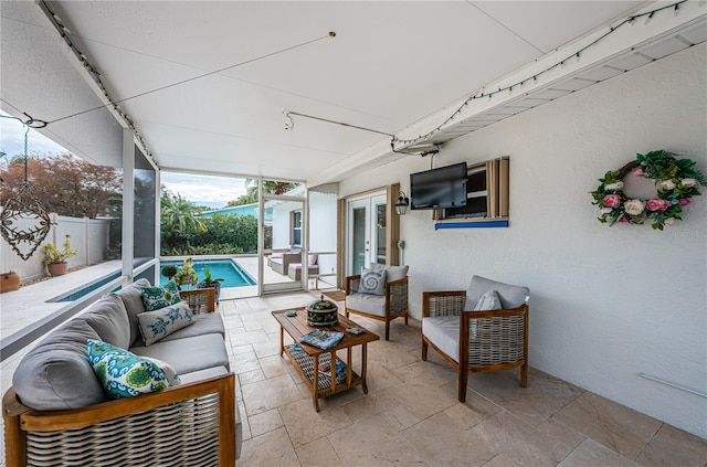 view of patio / terrace featuring an outdoor living space, a fenced in pool, and french doors