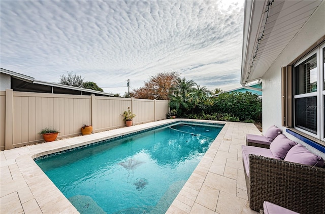 view of swimming pool featuring a patio area