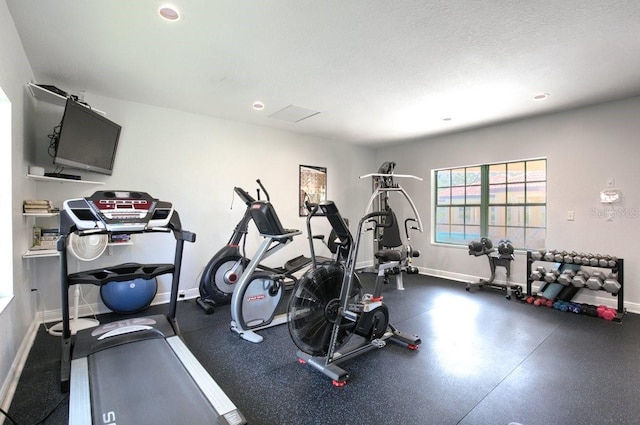 gym with a textured ceiling