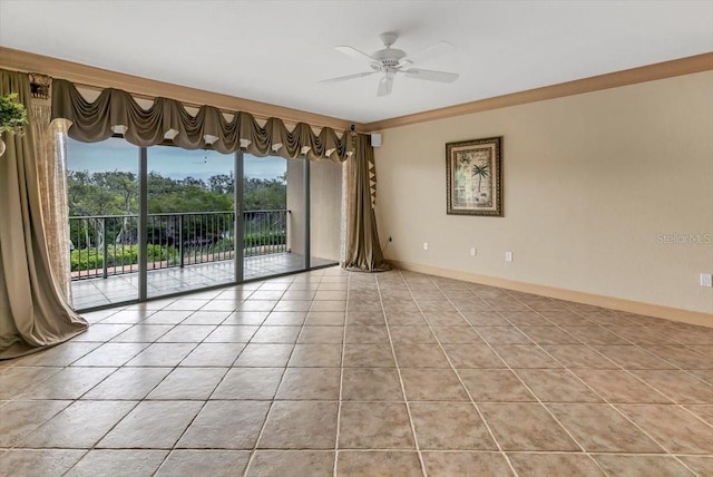 tiled empty room featuring ornamental molding and ceiling fan