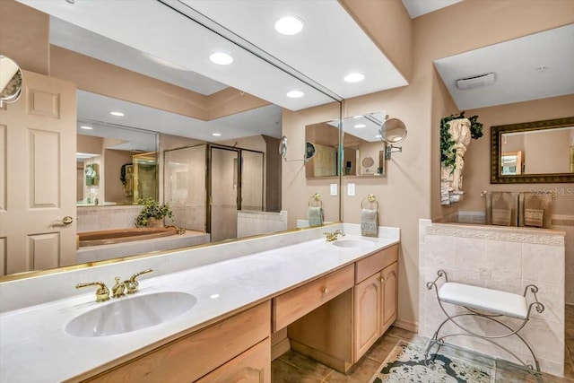 bathroom featuring tile patterned flooring, vanity, and plus walk in shower