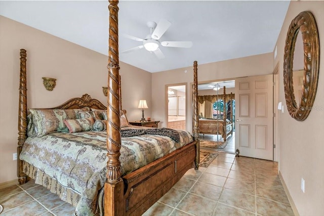 tiled bedroom with ceiling fan and ensuite bath