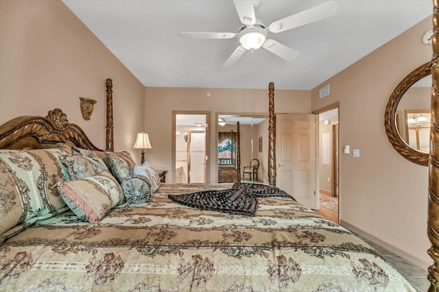 bedroom featuring connected bathroom, a closet, and ceiling fan