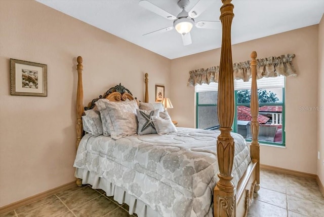 bedroom with ceiling fan and light tile patterned floors