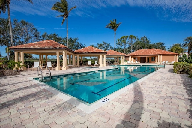 view of swimming pool featuring a gazebo and a patio