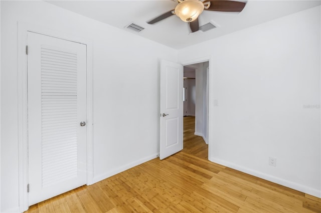 unfurnished bedroom featuring light wood-type flooring, visible vents, and baseboards