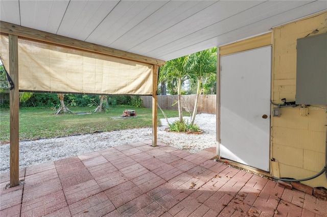 view of patio with a fenced backyard and water heater