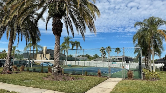 view of sport court featuring a yard