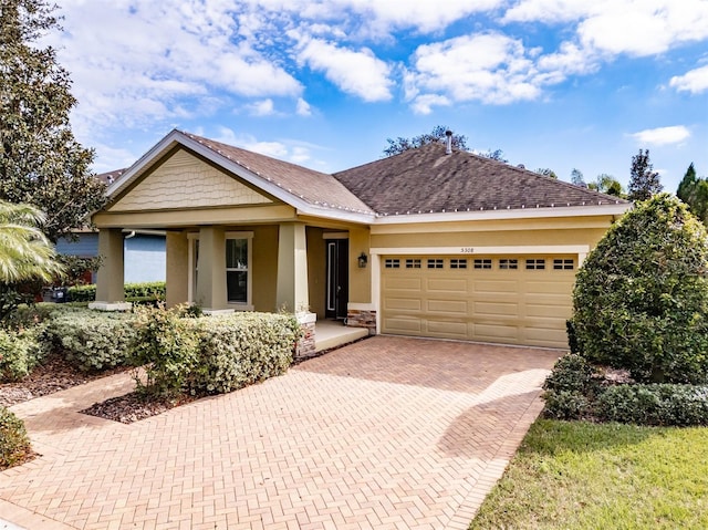 view of front of property featuring a porch and a garage