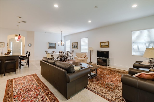 living room with an inviting chandelier