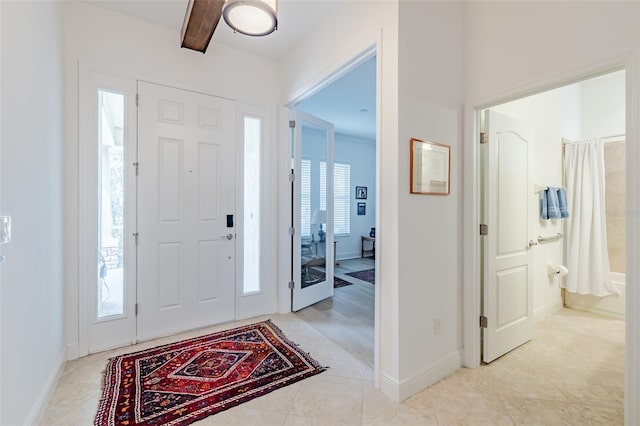 entrance foyer with beamed ceiling