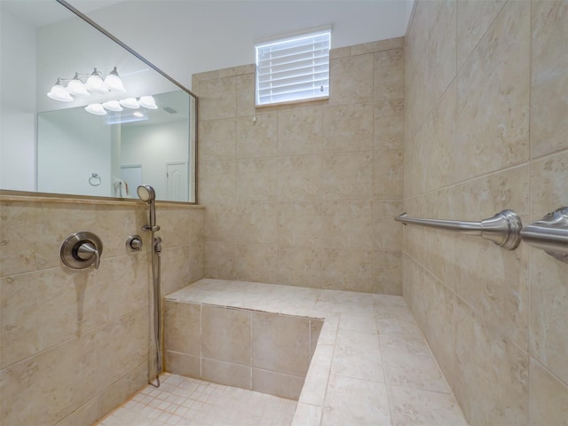 bathroom with tiled shower