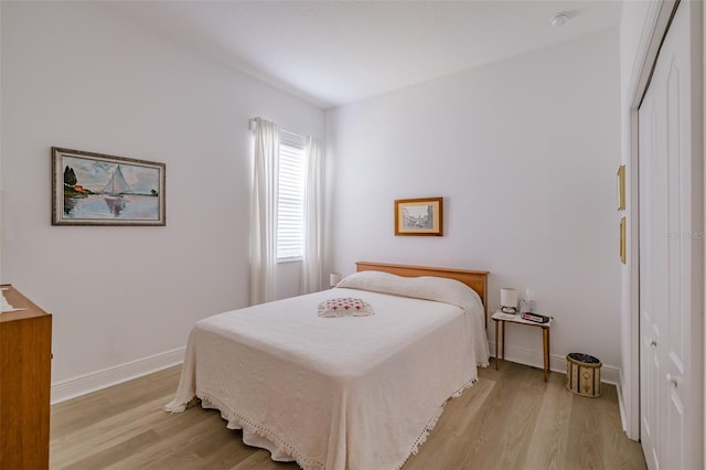 bedroom with light hardwood / wood-style floors