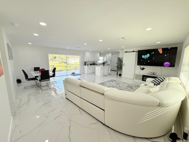 living room featuring a barn door