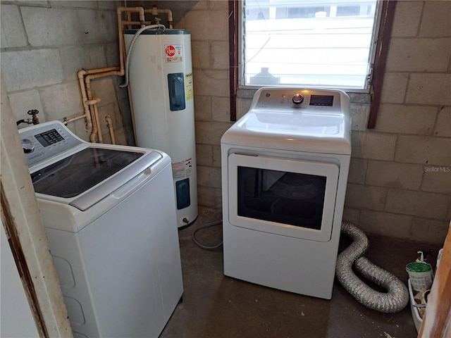 laundry area featuring washer and clothes dryer and water heater