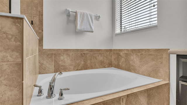 bathroom with tiled bath