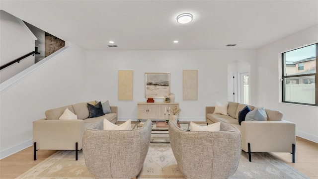 living room with light hardwood / wood-style flooring