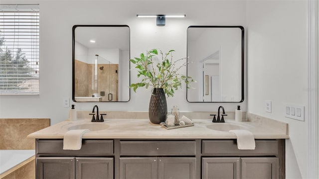 bathroom featuring vanity and shower with separate bathtub