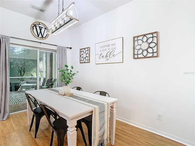 dining room featuring light hardwood / wood-style flooring