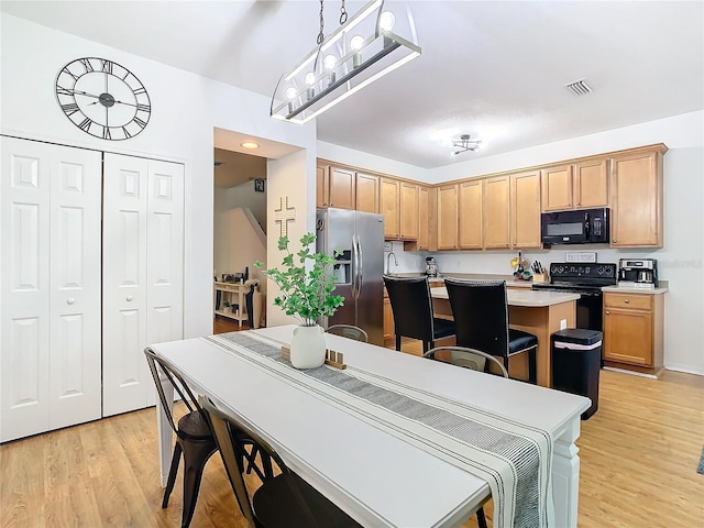 dining room featuring light hardwood / wood-style floors