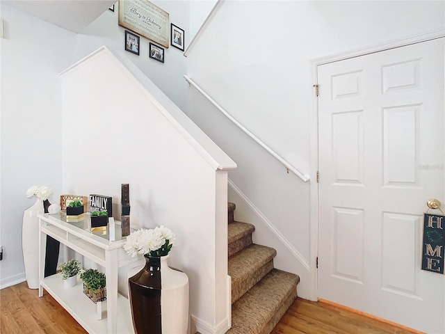 stairway featuring hardwood / wood-style floors