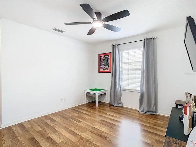 unfurnished bedroom featuring ceiling fan and wood-type flooring