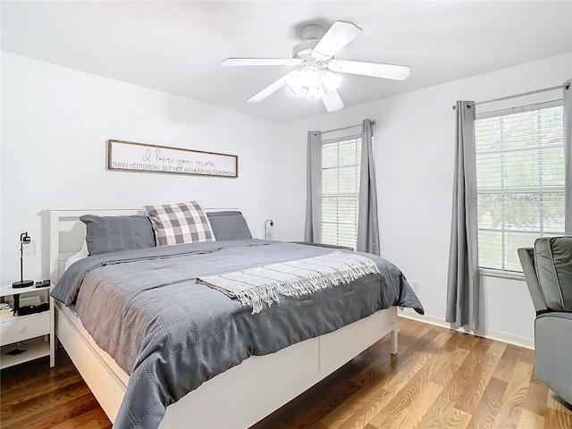 bedroom featuring hardwood / wood-style floors and ceiling fan