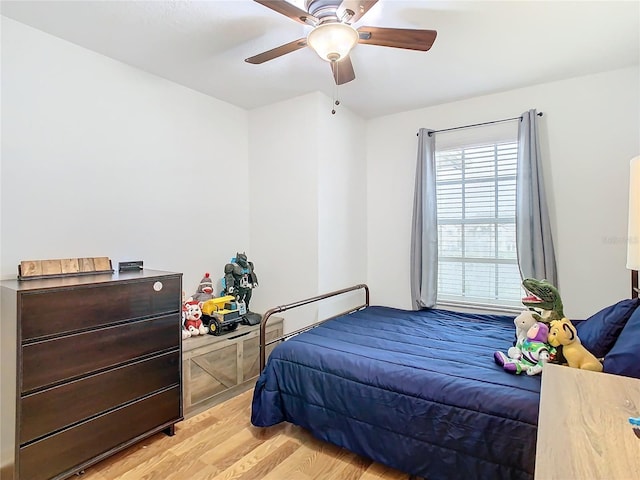 bedroom with ceiling fan and light wood-type flooring