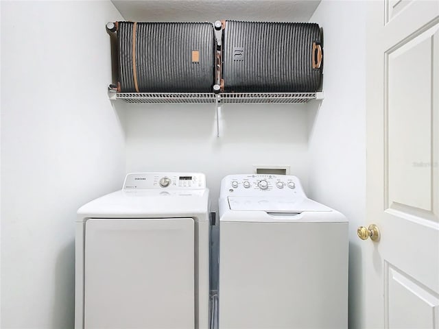 washroom featuring independent washer and dryer