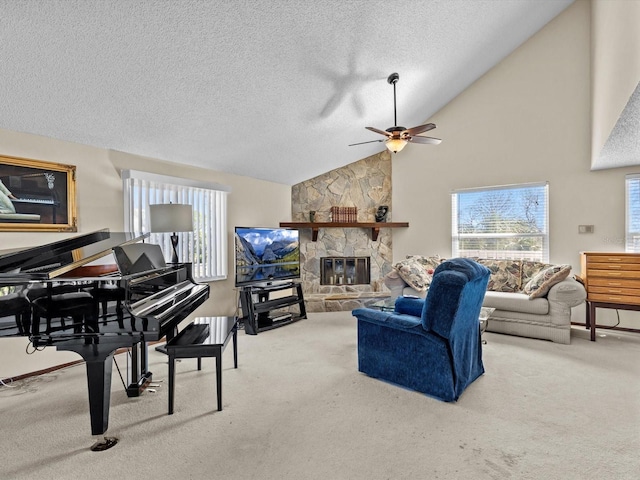 living room with ceiling fan, a fireplace, carpet floors, and a textured ceiling