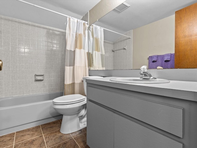 full bathroom featuring tile patterned flooring, shower / bath combo, vanity, and toilet