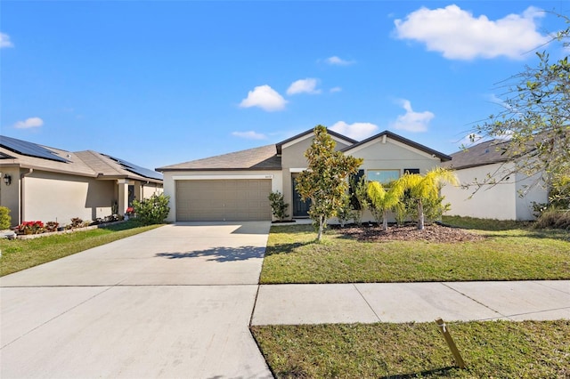 single story home featuring a garage and a front lawn