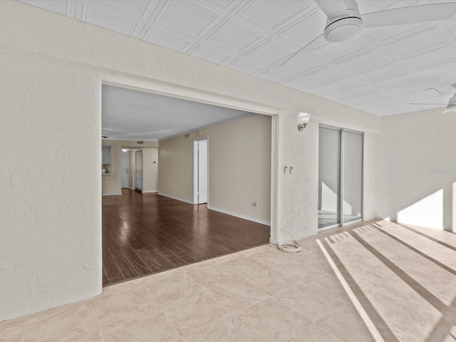 spare room with ceiling fan and hardwood / wood-style flooring