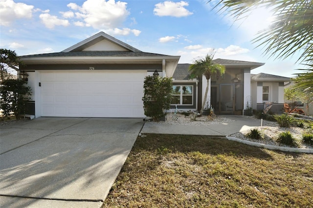 single story home with a garage, driveway, and stucco siding