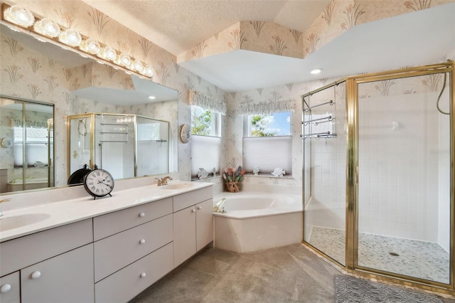 bathroom with wallpapered walls, a shower stall, a garden tub, and a sink