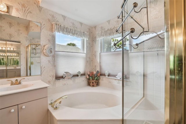 bathroom with a shower stall, vanity, a bath, and wallpapered walls