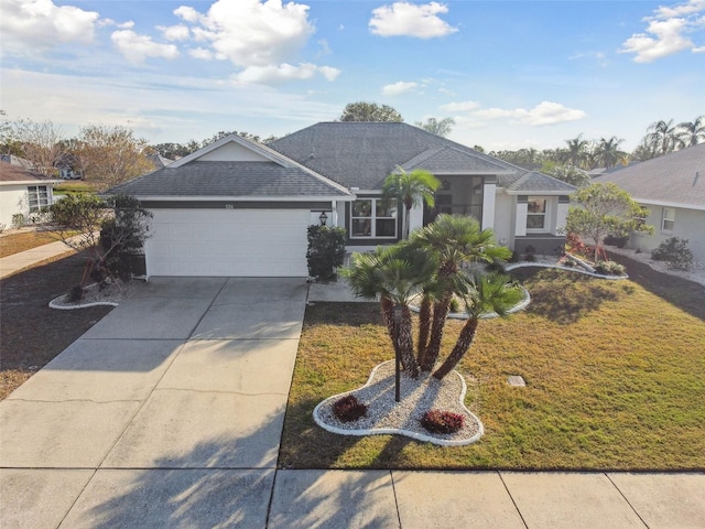 single story home with a garage, driveway, a front yard, and stucco siding