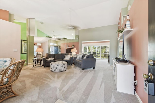 living area with high vaulted ceiling, light carpet, and baseboards