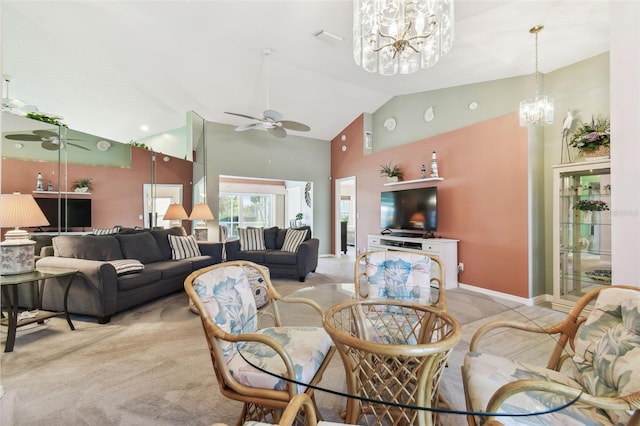 living room with high vaulted ceiling, light carpet, baseboards, and ceiling fan with notable chandelier