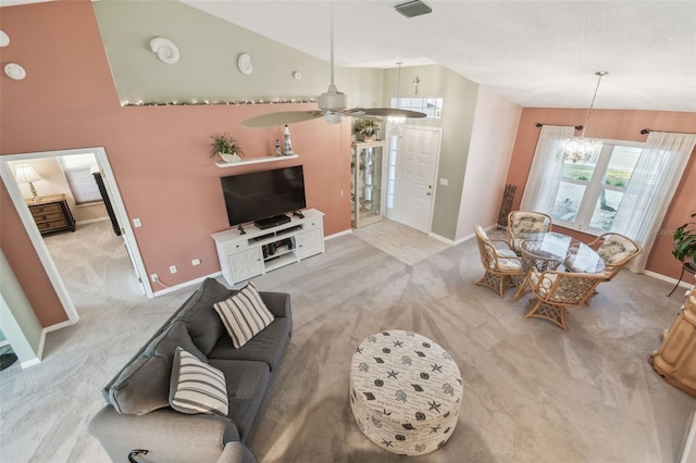 living room with light carpet, baseboards, and visible vents