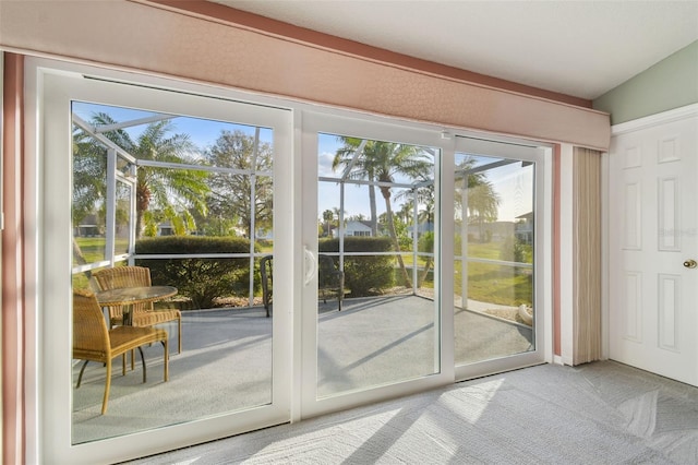 doorway featuring carpet flooring and a sunroom