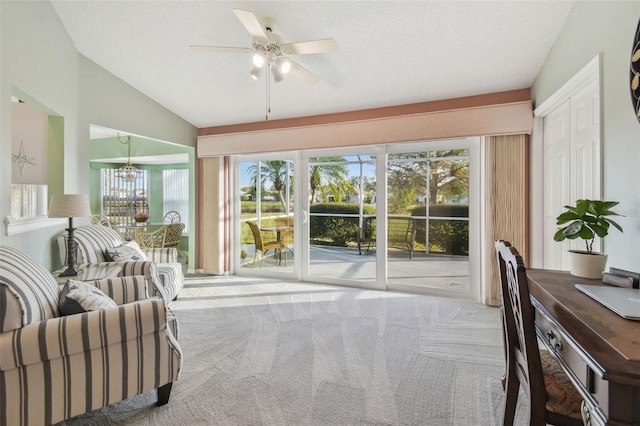 interior space with lofted ceiling and ceiling fan