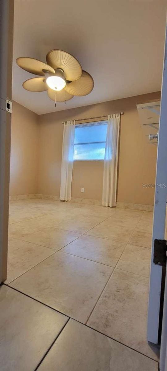 unfurnished room featuring ceiling fan